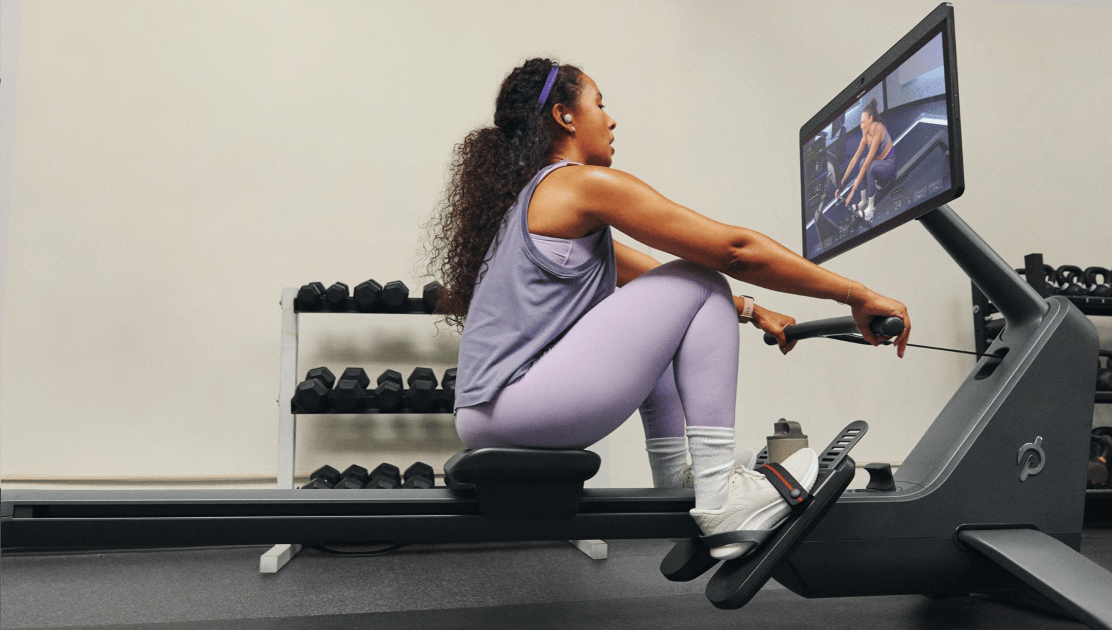 Exerciser on a yoga mat in a corporate gym