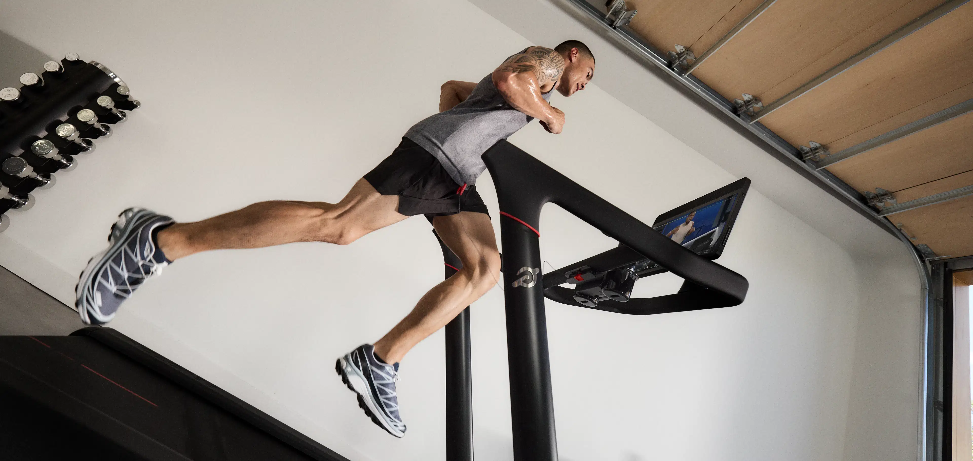 Man running on a Peloton Tread