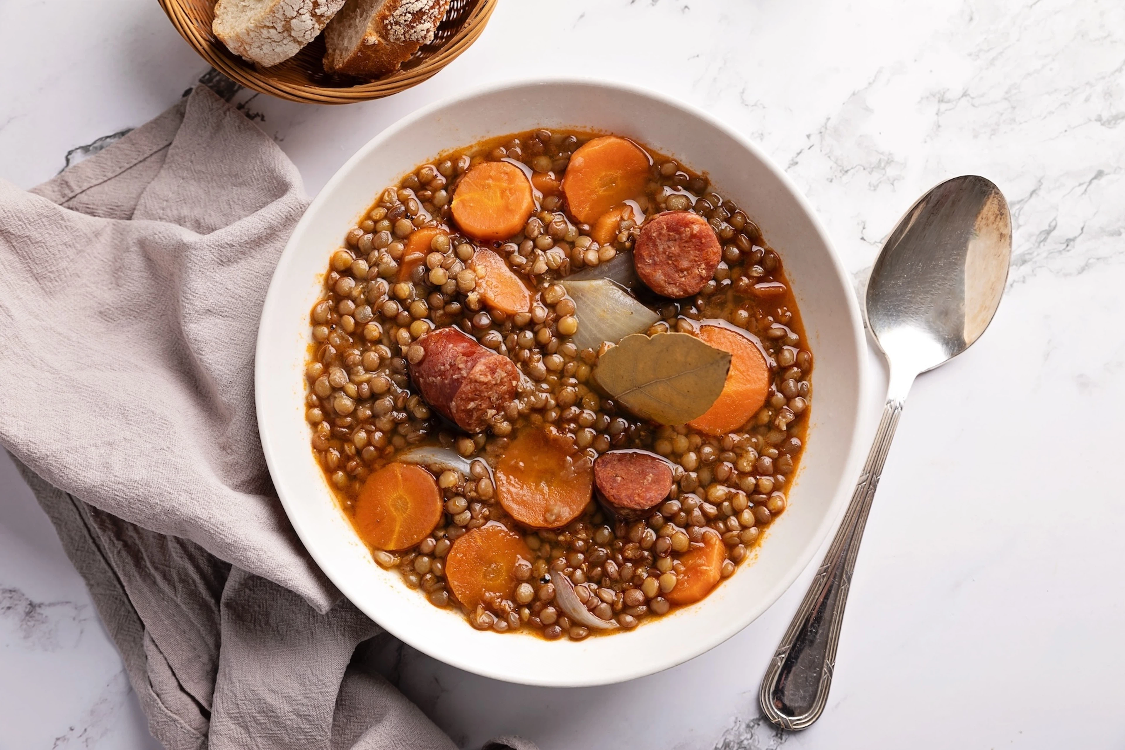 A bowl of lentil soup with chorizo.