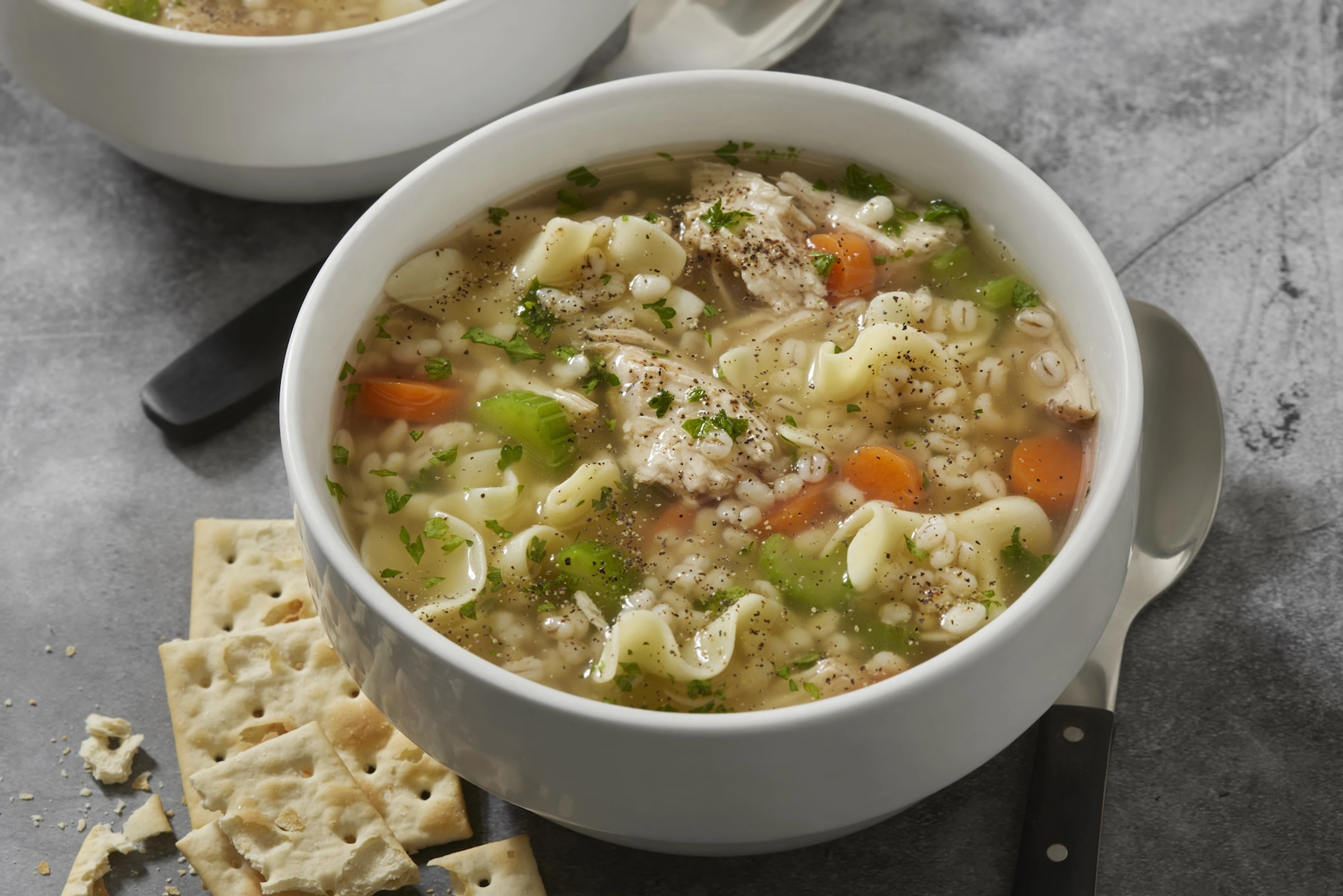 A bowl of chicken noodle soup. Chicken breast is a creatine-rich food.