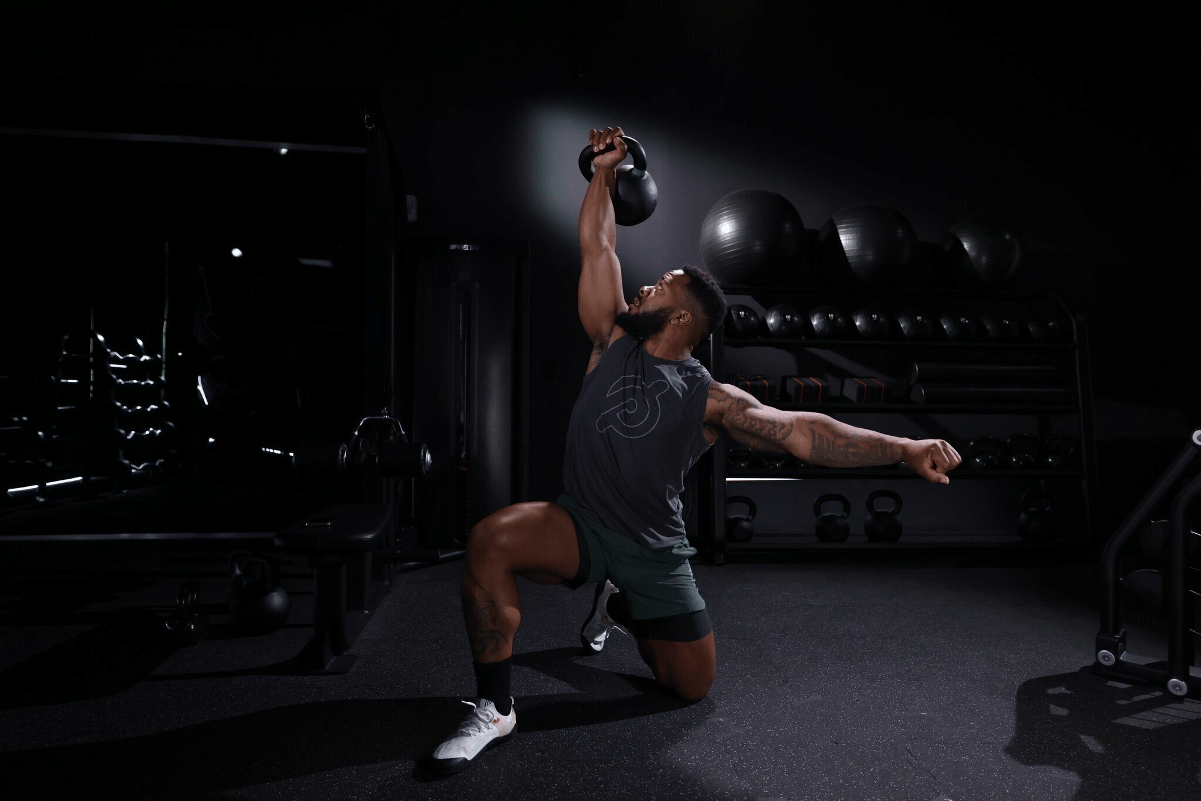 Dre Mayes demonstrates a kettlebell exercise  