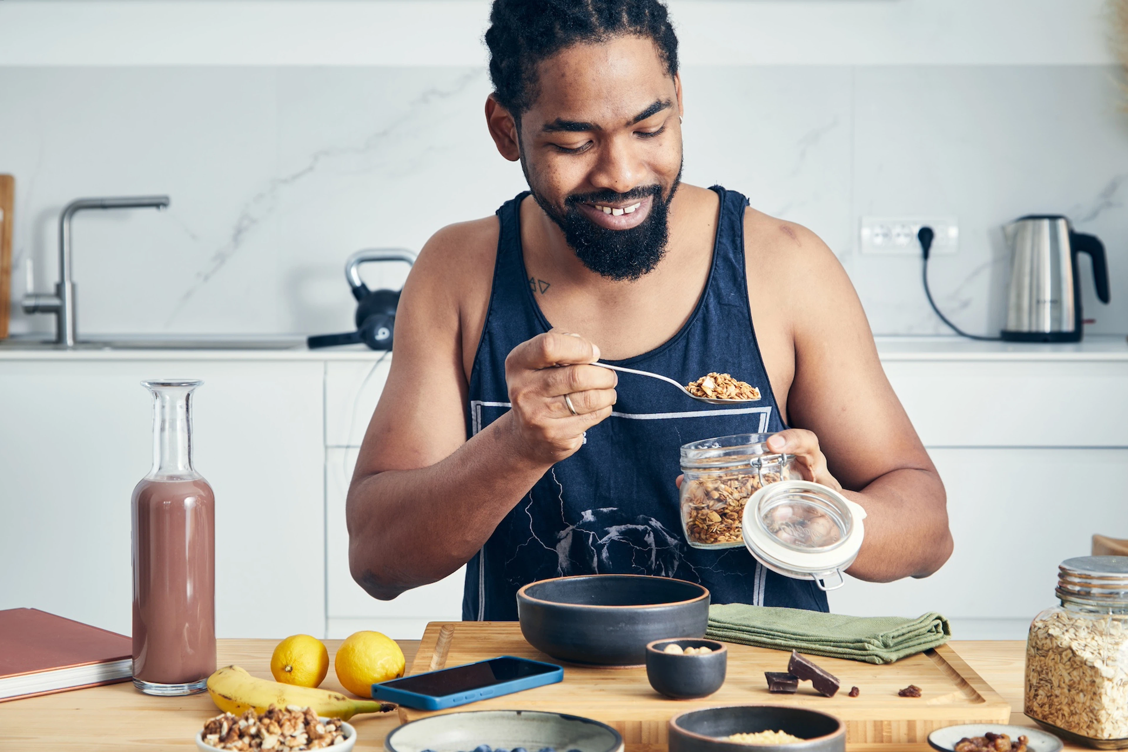 A man preparing oatmeal before going on a long run in the morning.