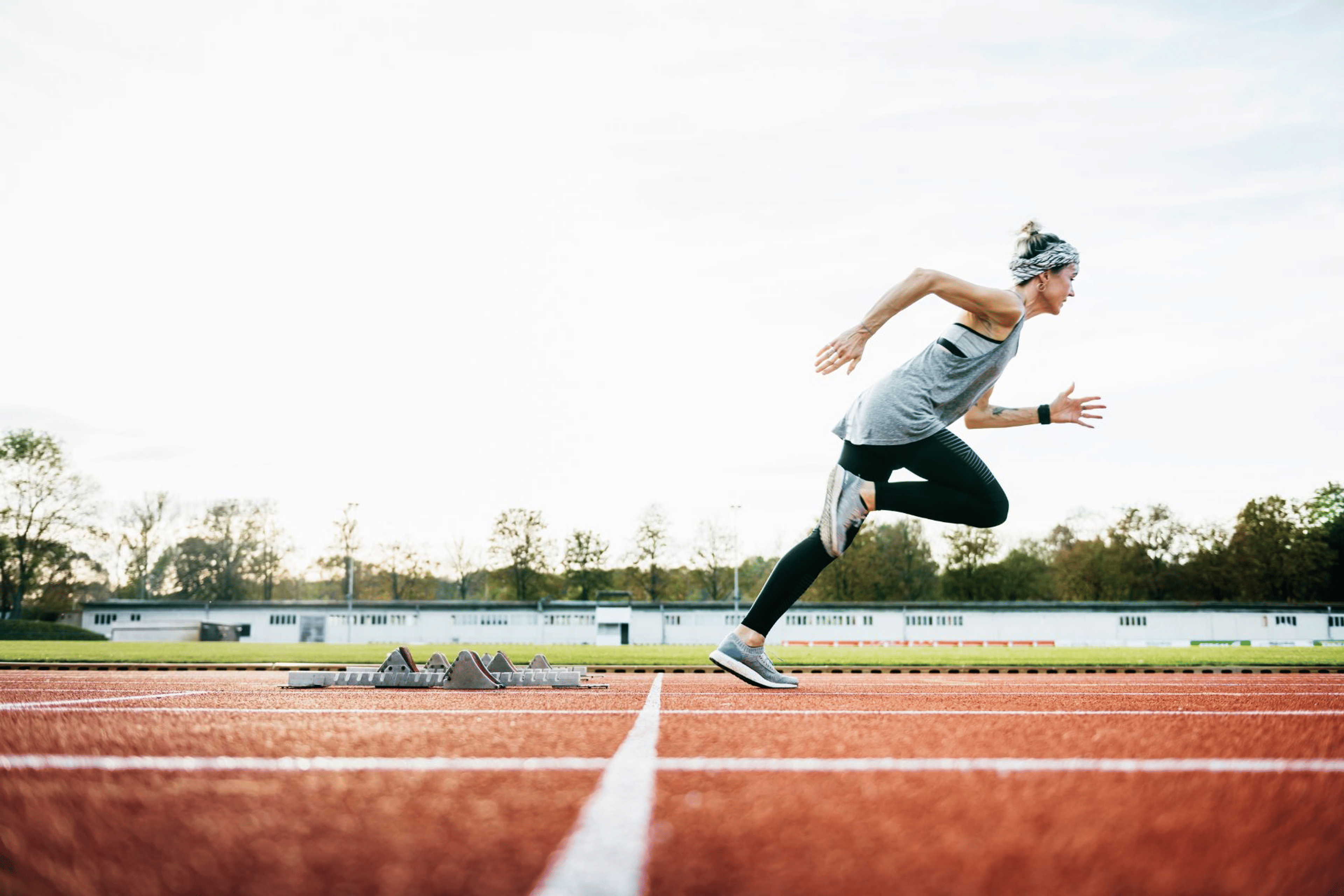 Woman sprinting on an outdoor track