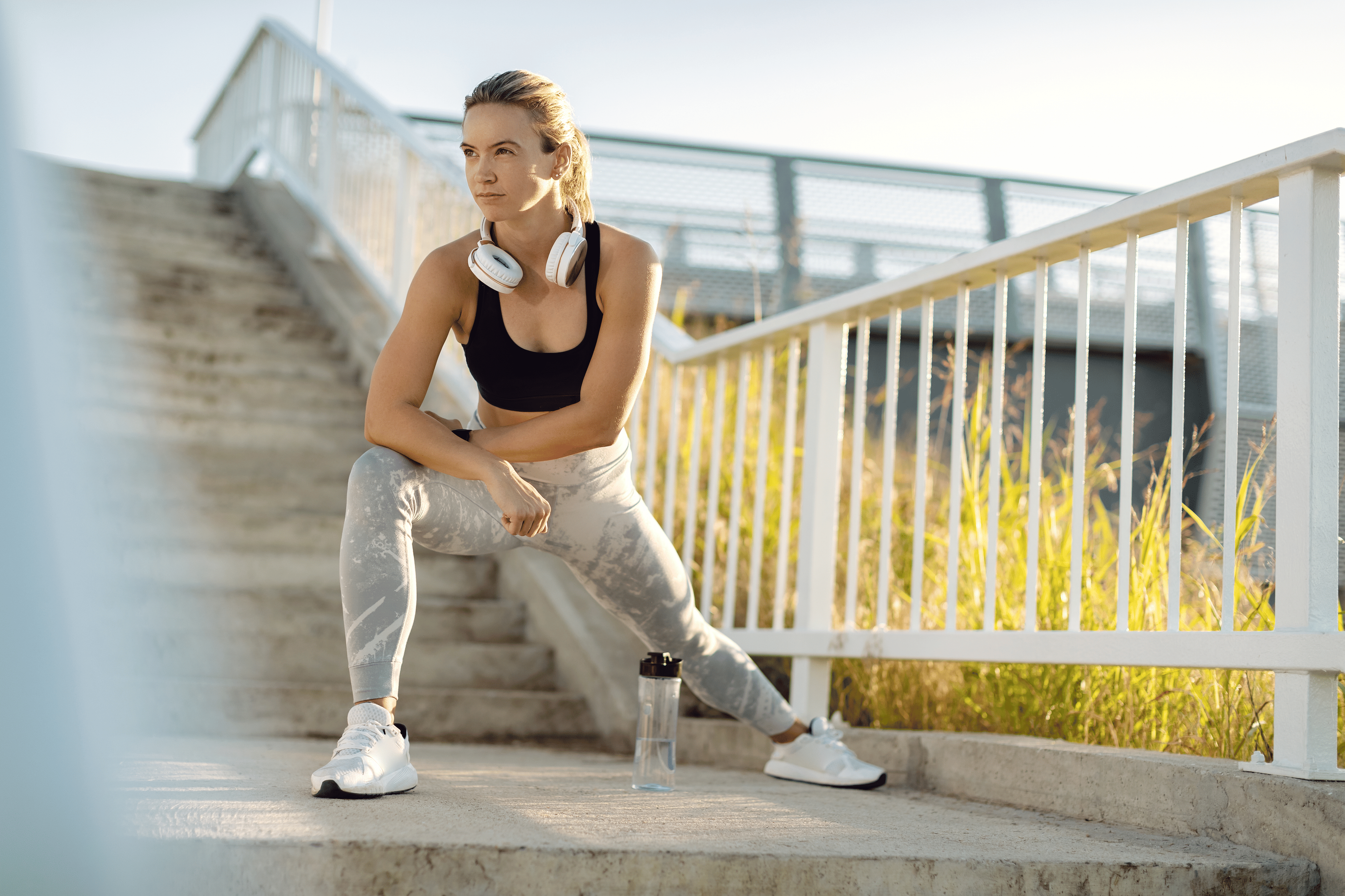 Woman stretches outdoors